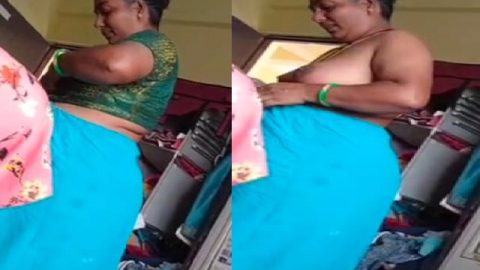 Grandmother wearing blouse and showing naked boobs