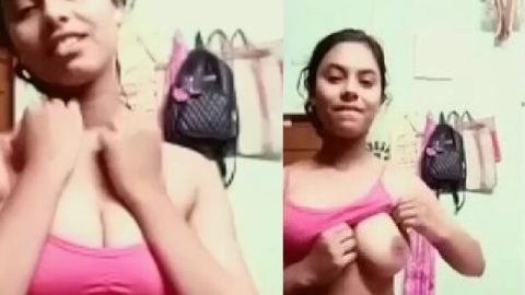 Pink bra girl lifting to show her firm big boobs